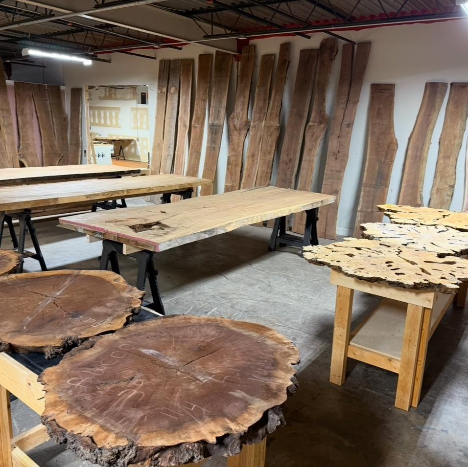 Live-edge slabs and burl rounds in the Statham workshop
